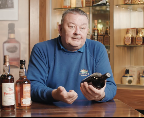 Andrew Symington with a bottle of whisky