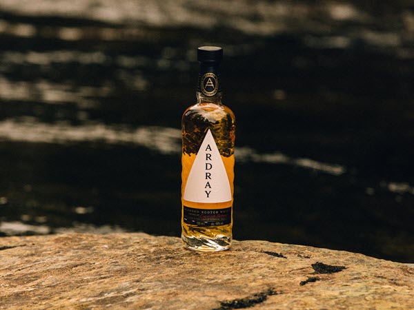 (A bottle of Ardray on a rock, with a lake in the background) Beam's new release Ardray is looking to reverse the slide that blended Scotch has seen in the US