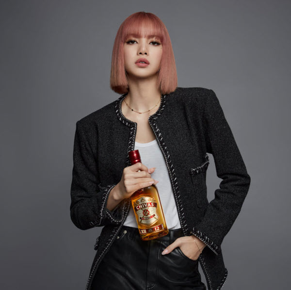 (A Chivas marketing shot, with Blackpink's Lisa holding a bottle of Chivas 12) Chivas' I Rise, We Rise campaign has seen their bottles in the hands of a wide range of celebrities