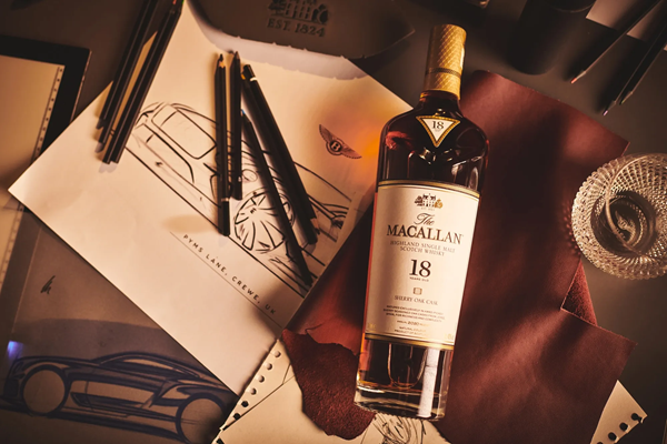 (Macallan 18yo, laid on an oak table with various Bentley merchandise) Limited editions, like Macallan's collaboration with Bentley, still have as much appeal as ever