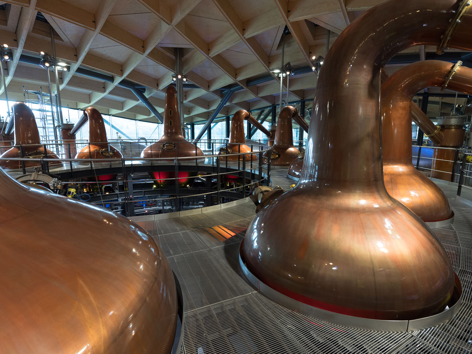 (Image of pot stills at Macallan distillery) Macallan distillery continues to use smaller stills - here at least, they're resisting the urge to scale up