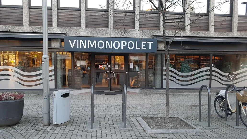 (image of the Norwegian state-based Vinmonopolet chain) The spirits monopoly in Norway helps the government bring in taxes, but also nudges buyers across the border