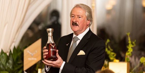 (Richard Paterson showcasing an old bottle of Dalmore whisky) Dalmore's transition to focussing on super-premium offerings under Paterson's watch has set it in a rivalry with Macallan