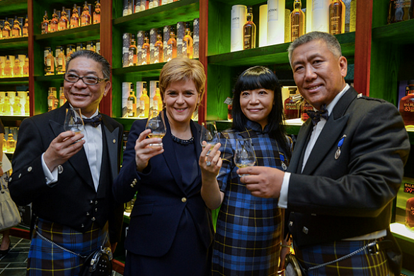 Mud in yer eye! Current SNP leader Nicola Sturgeon promotes Scotch at the 2015 opening of Beijing's Whisky Experience Centre