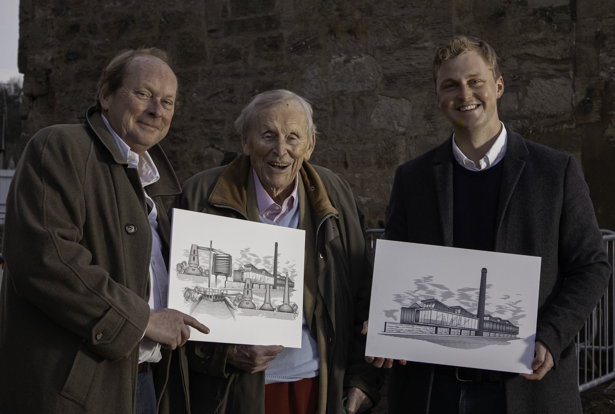 (l to r) Leonard, Peter, and Tom Russell show off their plans for the rebuilt Rosebank distillery