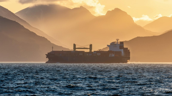 Cargo ship sailing across the ocean Cargo ship sailing across the ocean