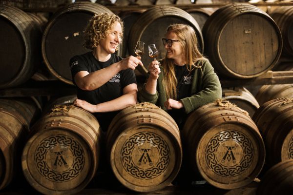 A dram infront of casks at Ardbeg