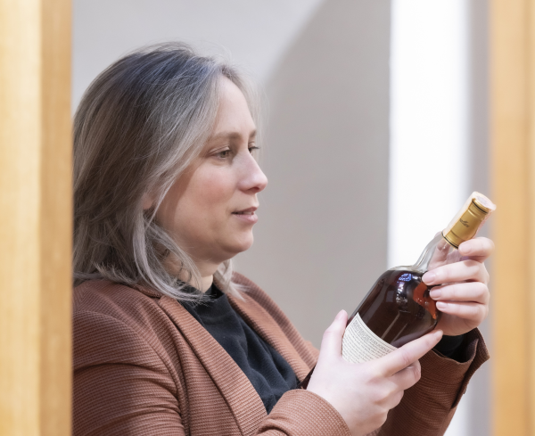  Isabel Graham-Yooll Studying a Bottle Of Whisky