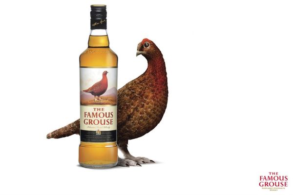 Grouse with a bottle of Famous Grouse